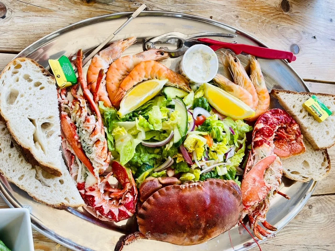 A seafood platter with crab, prawns, bread and salad at Stokeley