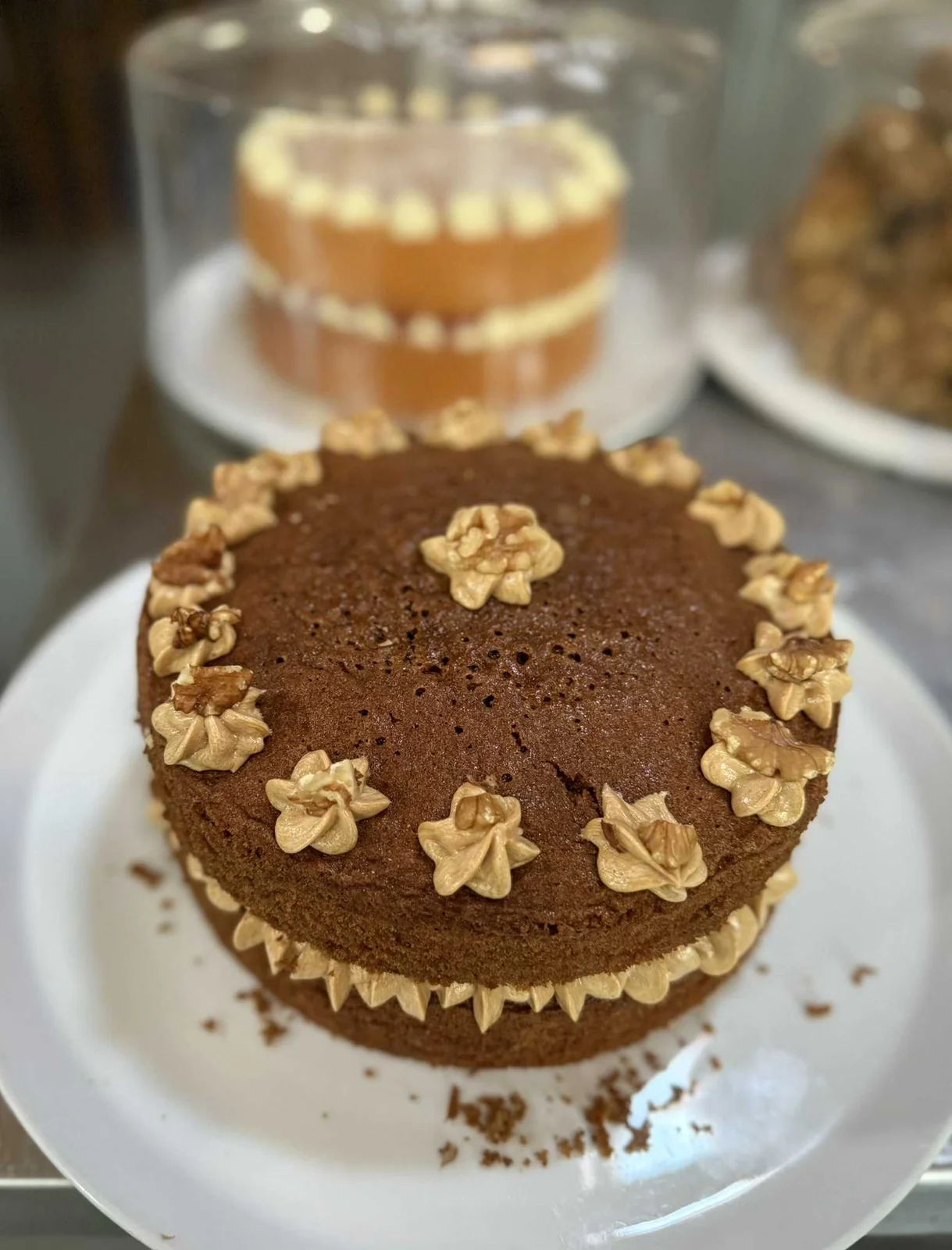A decorated cake on a stand at Stokeley