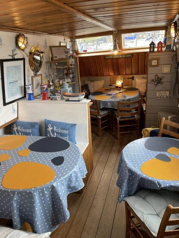 Tables inside the converted rescue boat