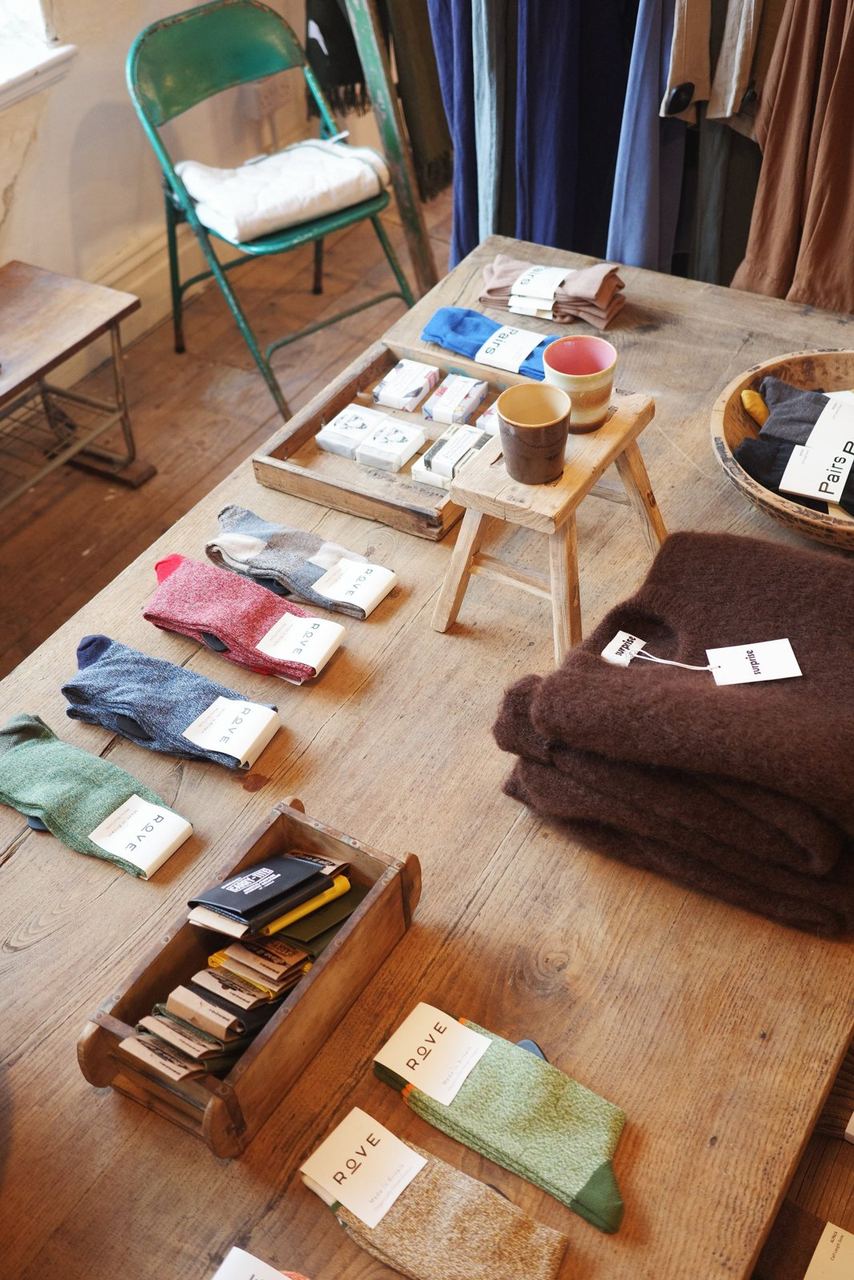 Colourful small objects arranged on a wooden display table