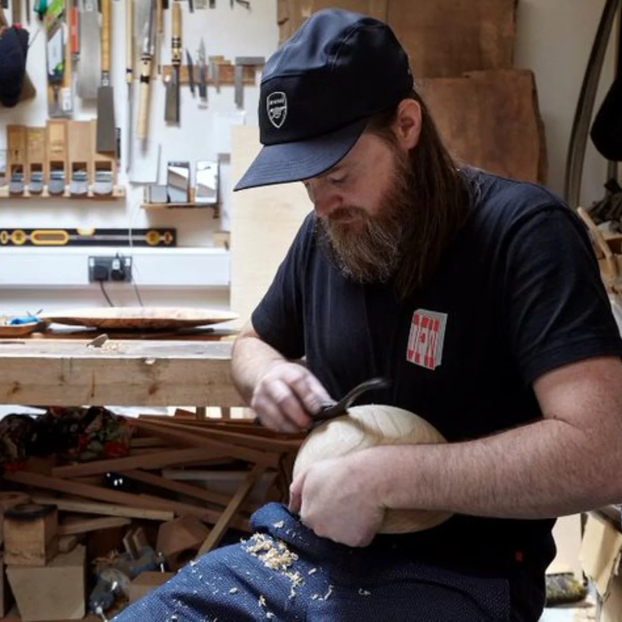 Mark McGilvray carving wood in the studio