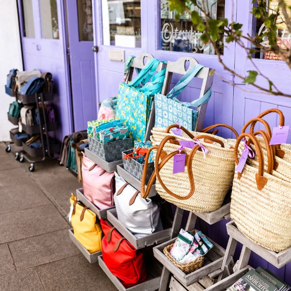 Colourful bags and woven baskets outside the lilac tessdesigns shopfront