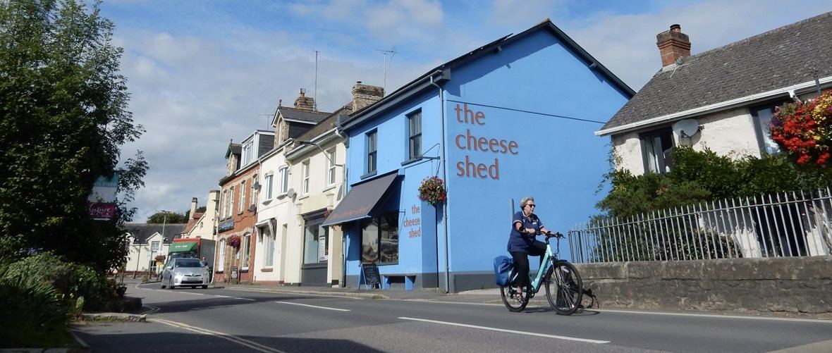Bright blue Cheese Shed building on Station Road