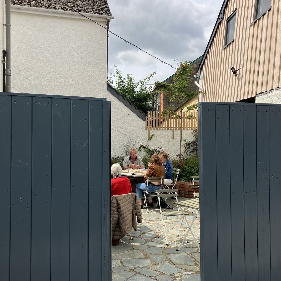 Grey gates leading into The Cheese Shed courtyard