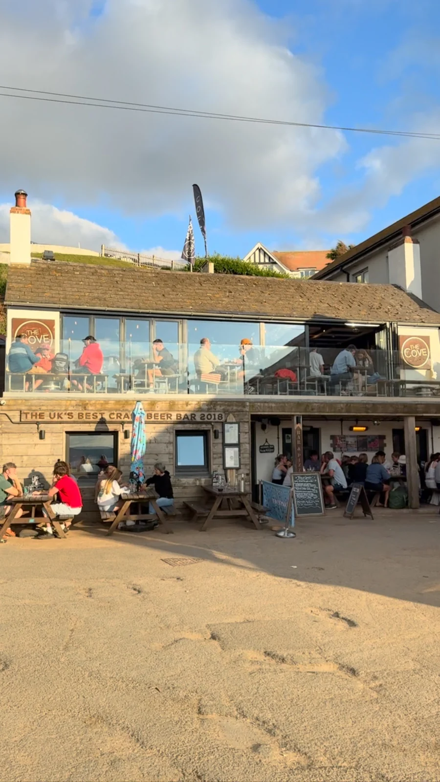 The Cove’s beach-facing building and terraces seen from the sand
