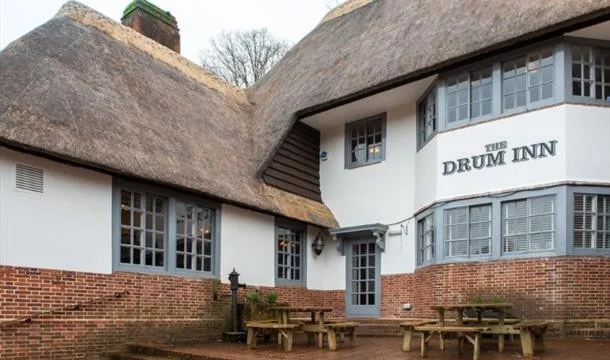 The Drum Inn’s white façade and thatched roof