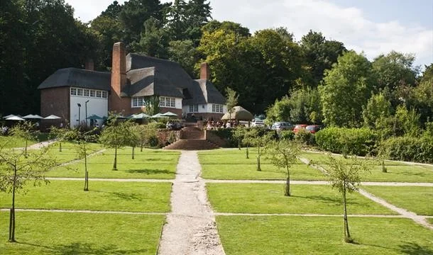 The Drum Inn seen across its formal garden paths