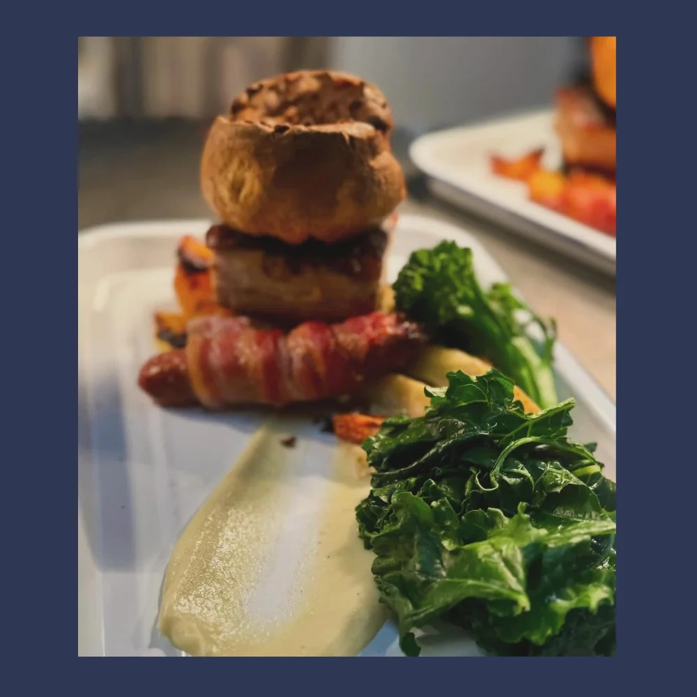 Roast dinner with Yorkshire pudding and vegetables at The Ring Feeder
