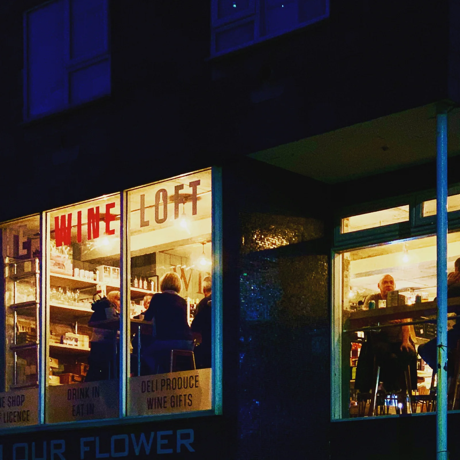 The Wine Loft illuminated in the evening