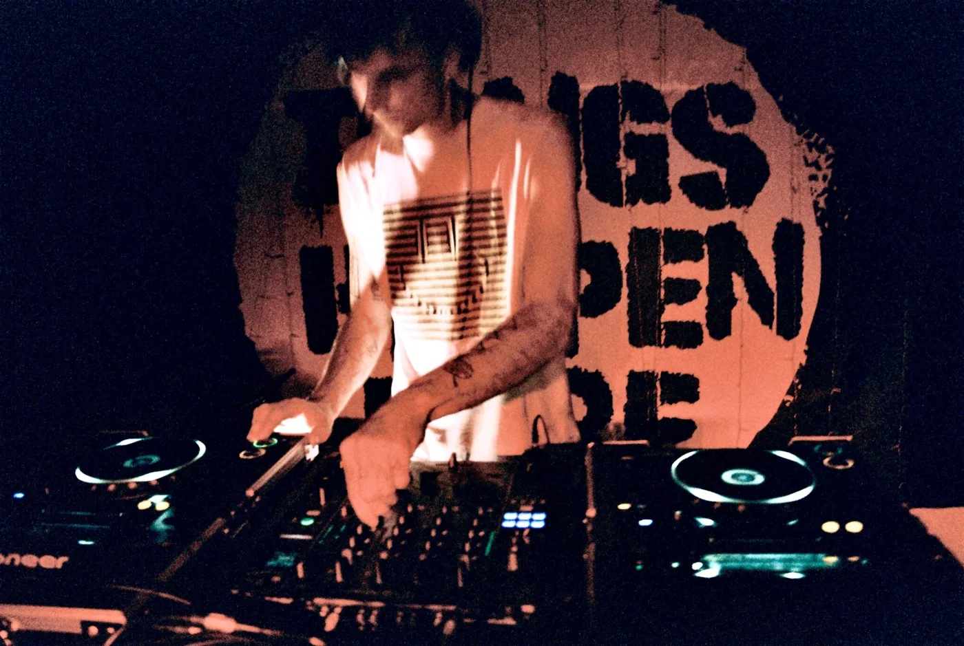 A DJ at the decks in Things Happen Here