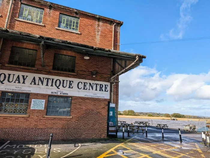 Brick Quay Antiques Centre beside the water with an estuary view