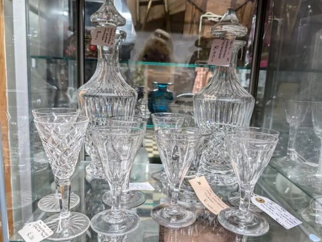 Cut-glass decanters and drinking glasses in a cabinet