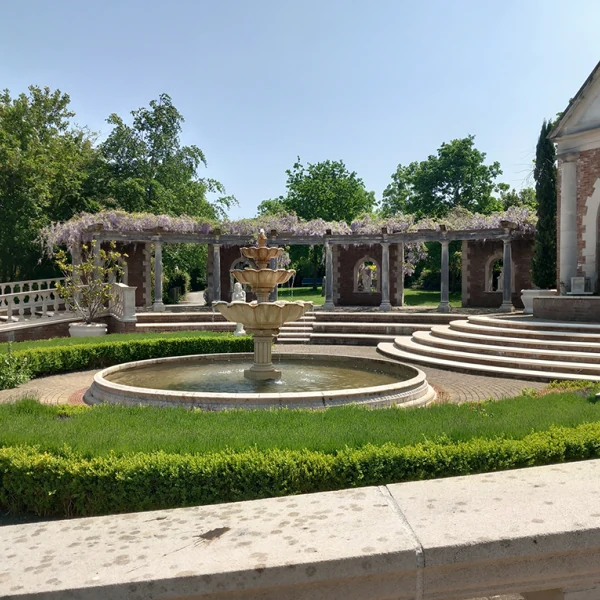 Circular fountain and clipped hedges
