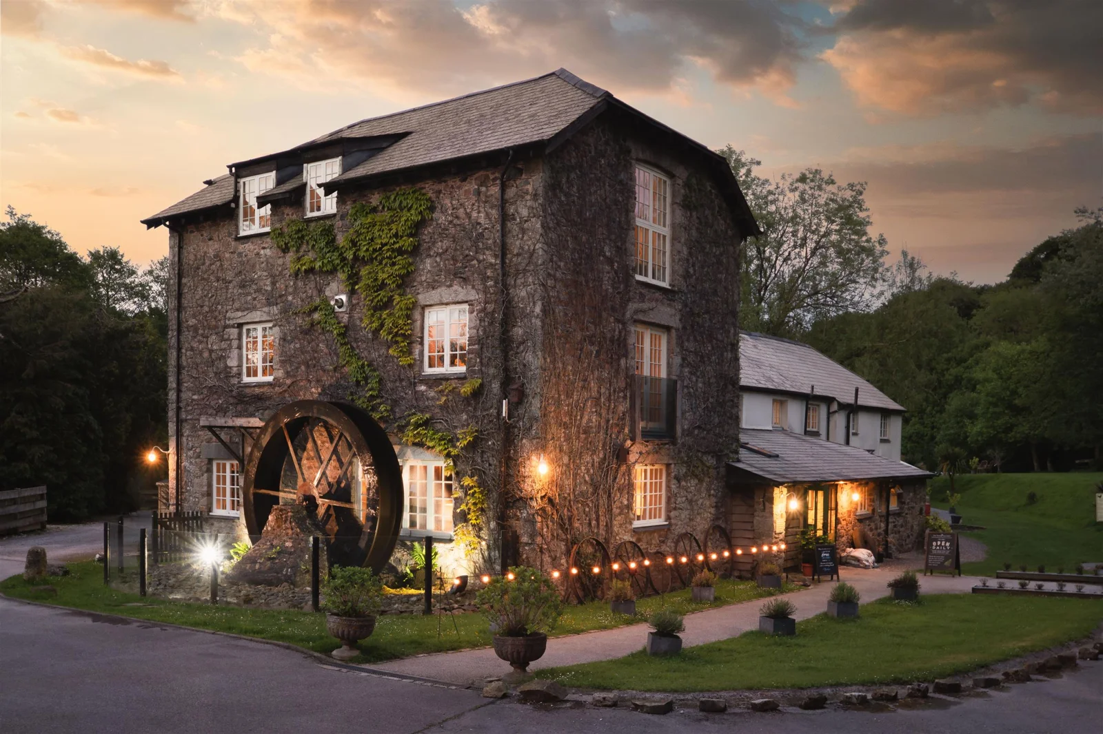 Turtley Corn Mill stone building and waterwheel at dusk
