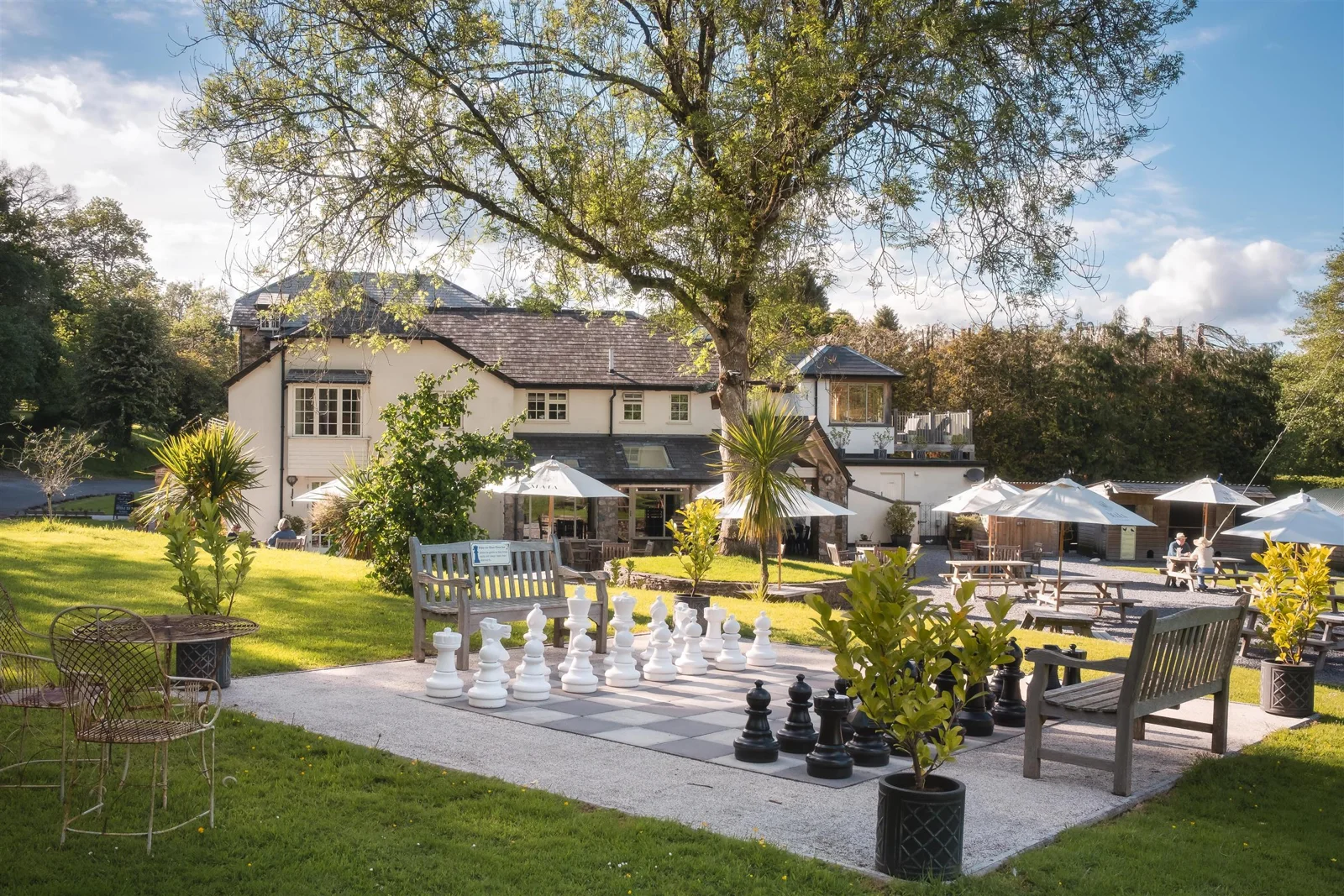 Garden tables and oversized chess pieces at Turtley Corn Mill
