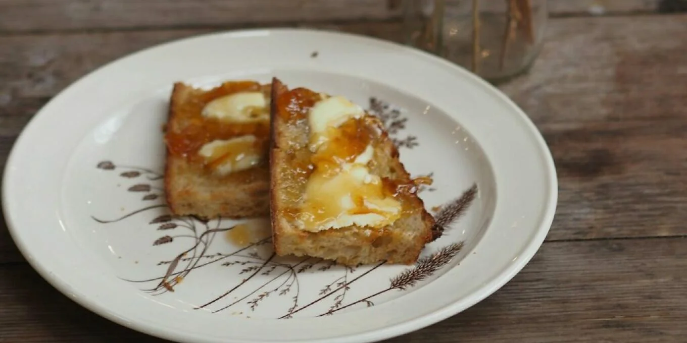 Two slices of cake on a patterned plate