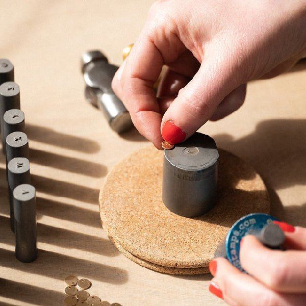 Hands working on a piece of jewellery