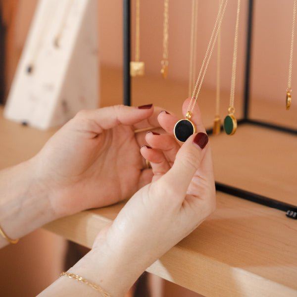 A customer looking at jewellery on display