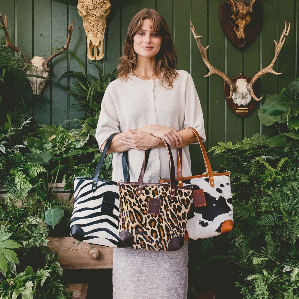 Will Bees Bespoke animal-print totes displayed by a model