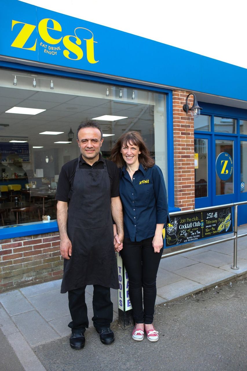 The founders outside the blue-fronted Zest café